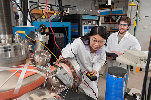 Two students in lab coats