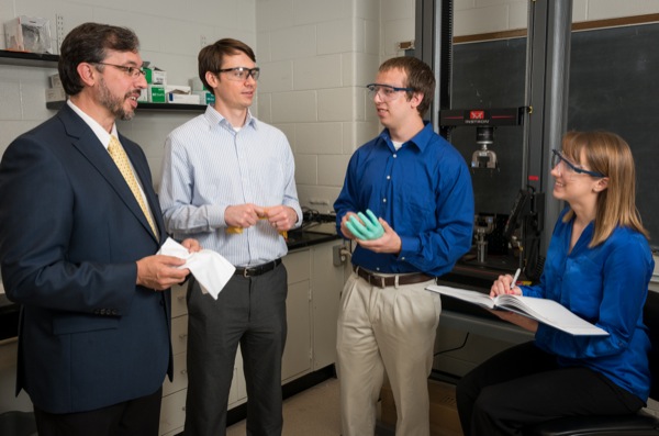 Norm Wagner (suit jacket), Richard Dombrowski (white, button-down shirt), Lauren Piascinski and Erik Hobbs (drk. blue shirt) for the Board of Trustees presentation about STF - shear thickening fluids.