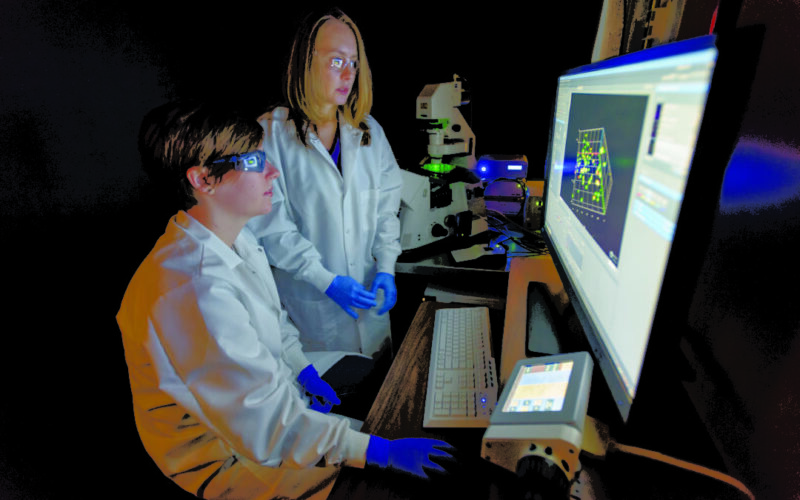 Professor Kloxin and student in front of computer