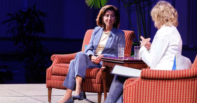 U.S. Commerce Secretary Gina Raimondo speaks onstage with Biden Institute Chair Valerie Biden Owens.